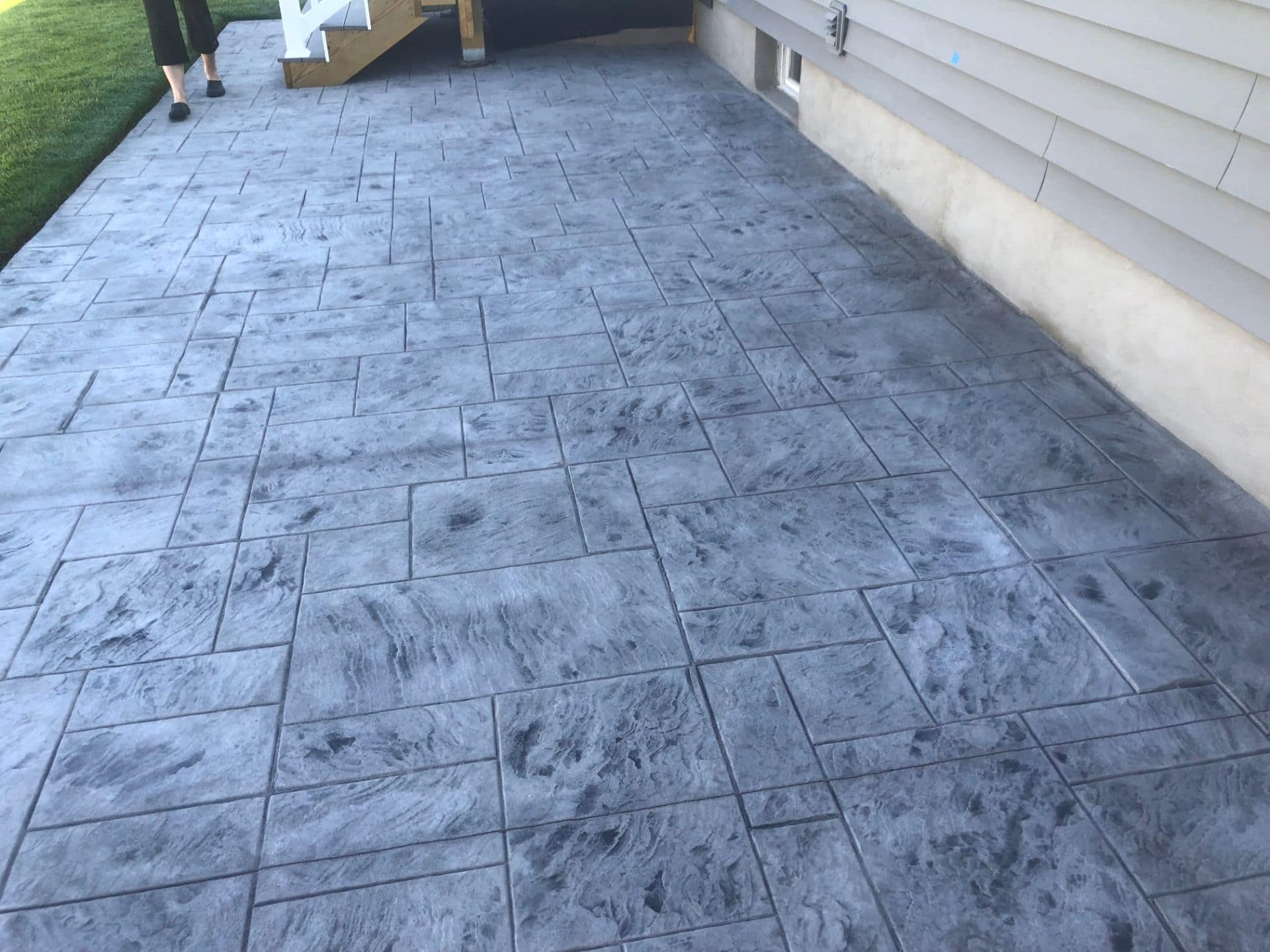 Stamped Concrete — Decorative stamped finishes that mimic stone and pavers without the weeds.