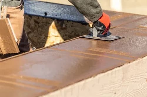 Elements Concrete Construction crew screeding a freshly poured concrete slab on a Bordentown, New Jersey job site
